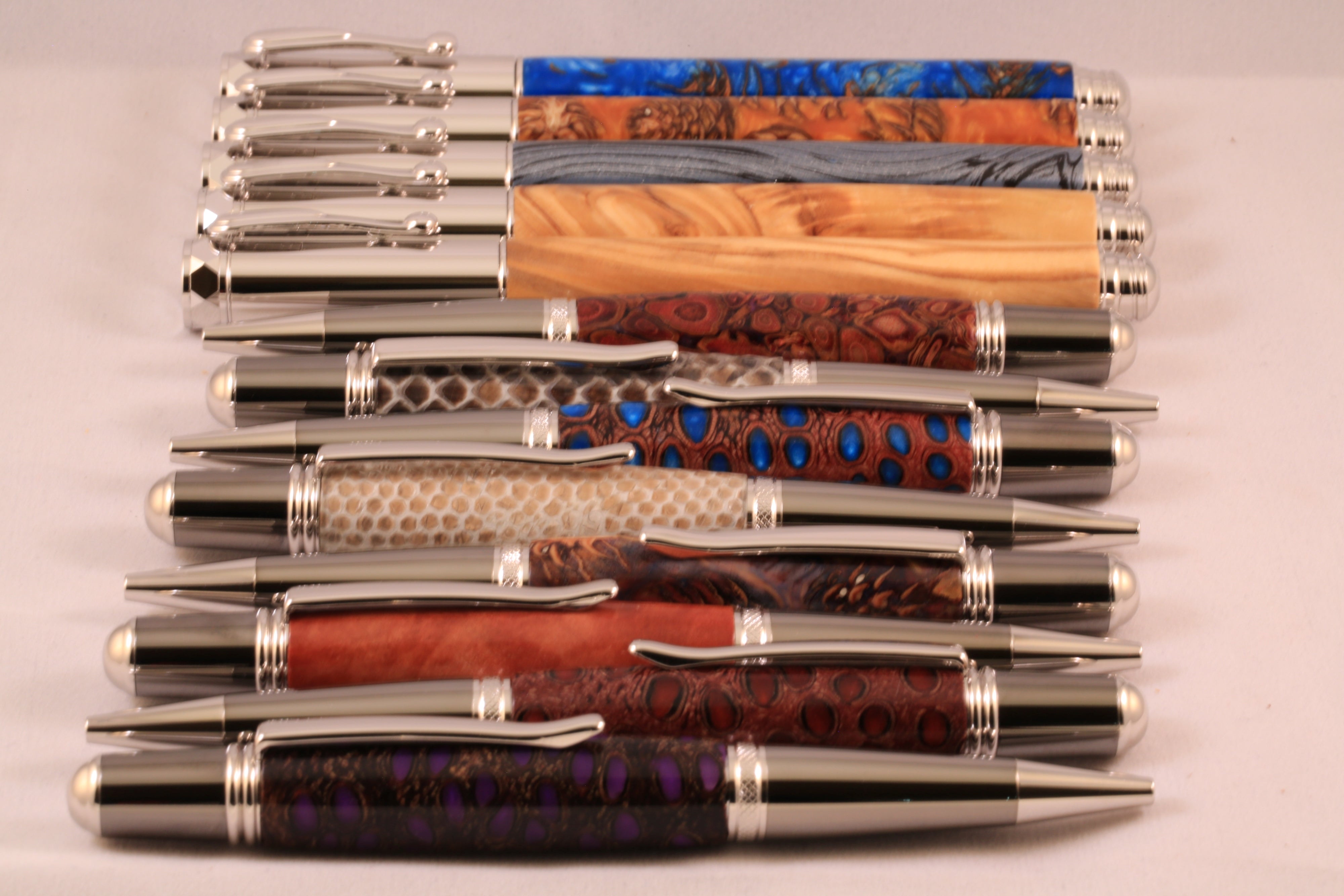 Lots of pens displayed on a flat table